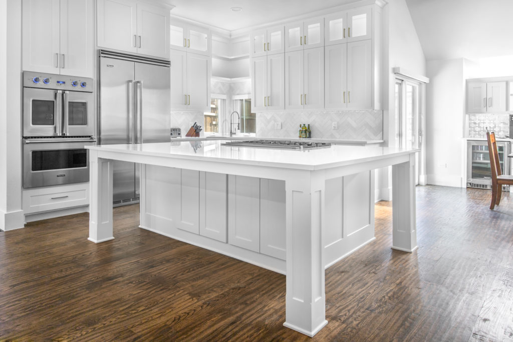 White cabinetry and island