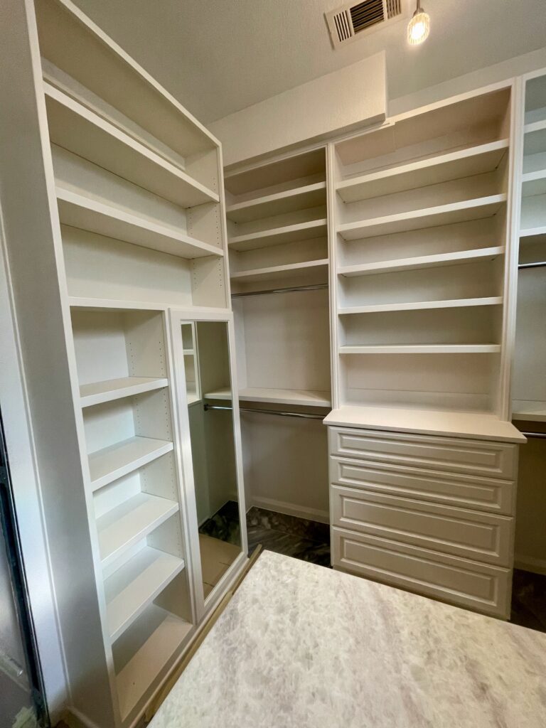 custom closet with hanging room and drawers